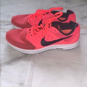 Hot pink Nike running shoes